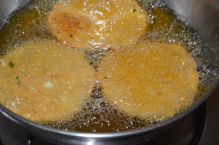 Step 5: Gently slide them into moderately hot oil. Don't overcrowd them. Once they are firm, turn them to ensure uniform frying. Keep the heat medium-high in the beginning.
