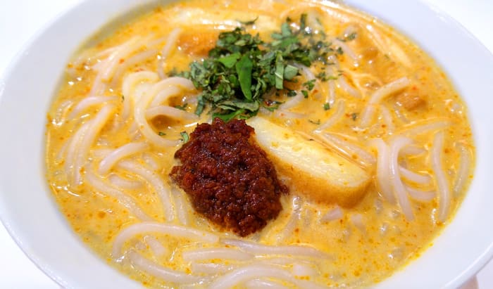 “Katong-style” Singaporean laksa. This version is eaten with a spoon and cooked using cut thick rice noodles.