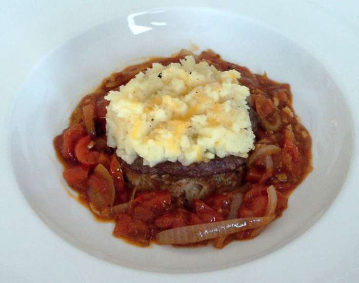 Buffalo, tomato and basil burger topped with crispy cheese mash and served with homemade tomato sauce