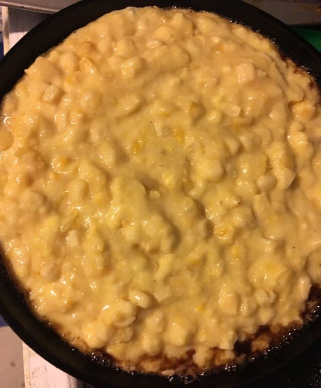 Combine your ingredients, then pour the mixture into a hot oven-friendly skillet. You know you got it hot enough when you hear it sizzle and the sides bubble with grease.