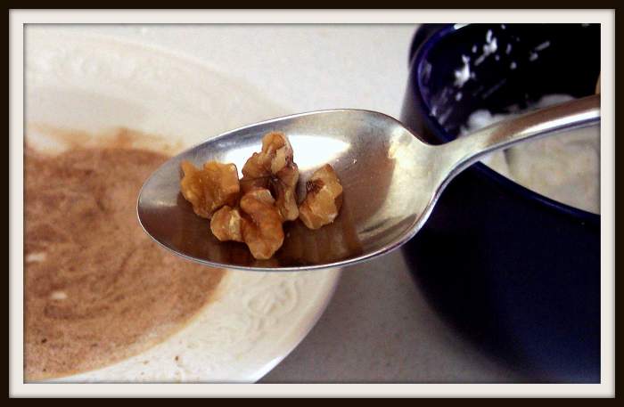 Although it is easier to work with larger pieces (i.e., whole and half nuts), you can group bits together using a spoon. Dip the spoon in the egg white then drop it in the sugar/spice mixture.