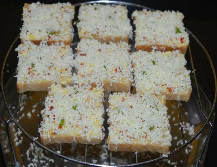 Step four: Once again, grate the cheese on the top. Sprinkle a very small amount of salt on top. Keep in mind that cheese contains some salt, so don't add too much salt.