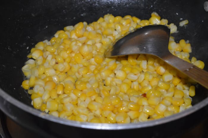 In the same pan, saute the baby corn kernels for 2-3 minutes. Transfer the mixure to the same plate as the paneer.
