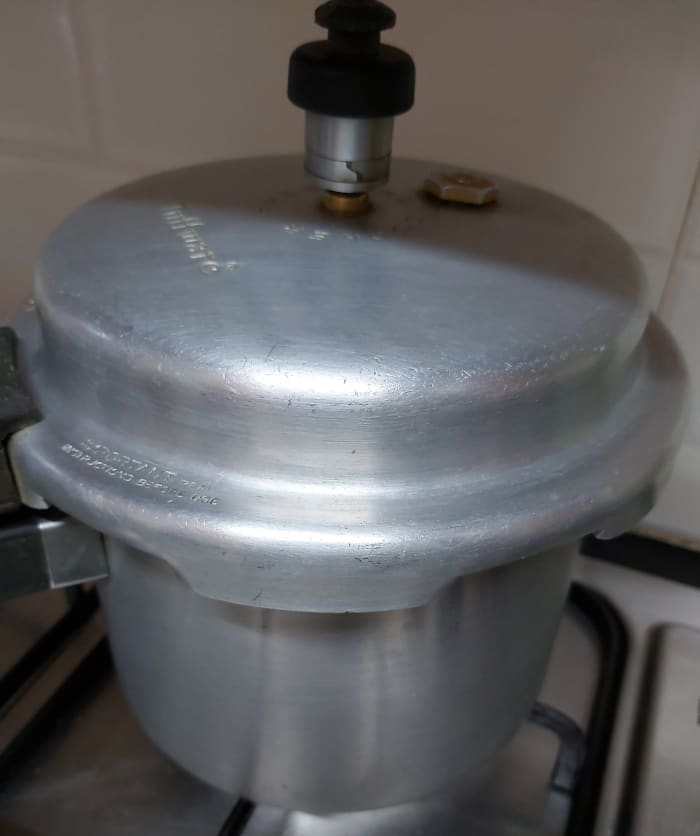 Close the lid and cook until 4-5 whistles, or until the dal is well cooked. Switch off the heat and let the pressure release by itself.