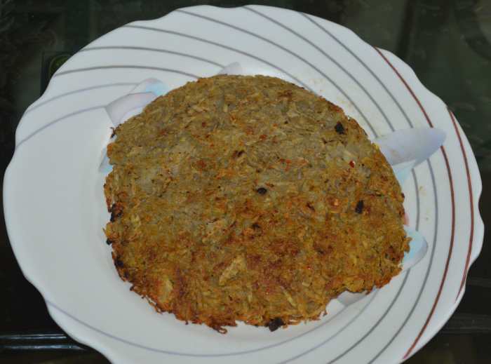 Step five: Cook until the other side also becomes crispy and brown. Turn off heat. Place a plate on the pan to cover it completely and invert the pan. You will get a yummy cheesy potato rosti. Enjoy it hot with some hot sauce on the side.