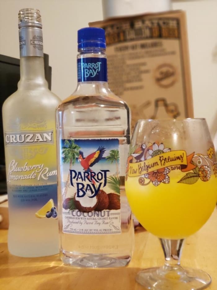 This is Nic's favorite drink. Keep the standard orange juice, ice, and Sprite and just add one ounce of coconut rum and two ounces of the blueberry lemonade rum.