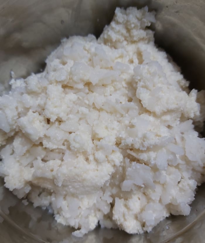 Transfer these soaked mixture to a mixer jar (do not drain extra water if any. It can be used for grinding).