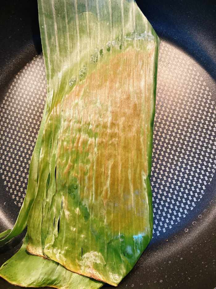 Transfer the pancake into the pan. Cook for 5 minutes each side or until the banana leaf started to turn slightly scorched.