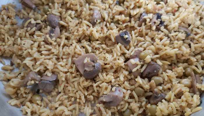 Once the pressure releases, open the cooker, sprinkle 4-5 drops of lemon juice. Mix well without breaking the rice grains.