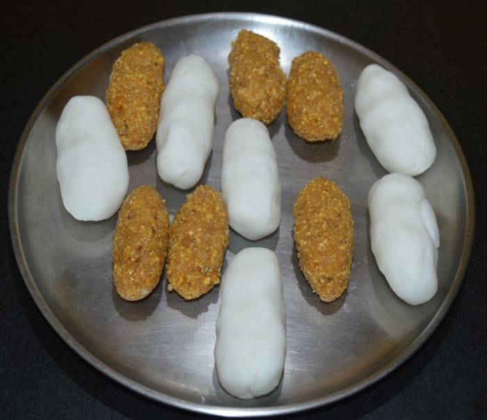 Step five: Divide the stuffing and the dough into six equal sized portions. Give each of them an elongated shape.