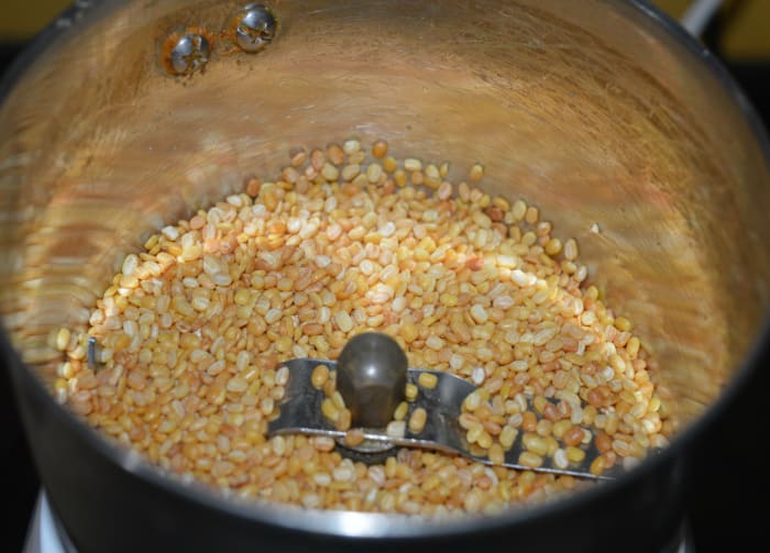 Step one: Roast the split mung beans (moong dal) until they become golden brown and give a nice aroma. Allow it to cool.