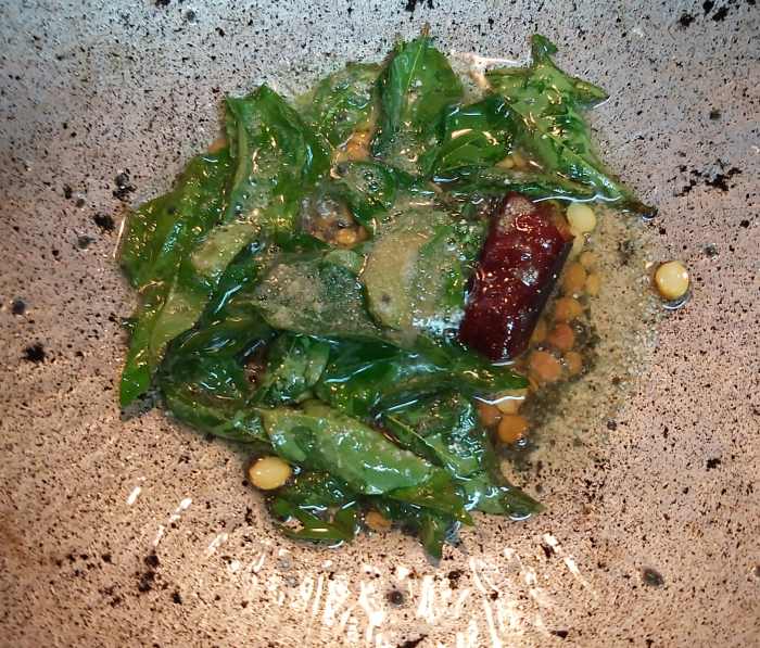 Add 1-2 broken red chilies, 1-2 strings of fresh curry leaves and 1/4 teaspoon of hing or asafoetida. Saute for a few seconds.