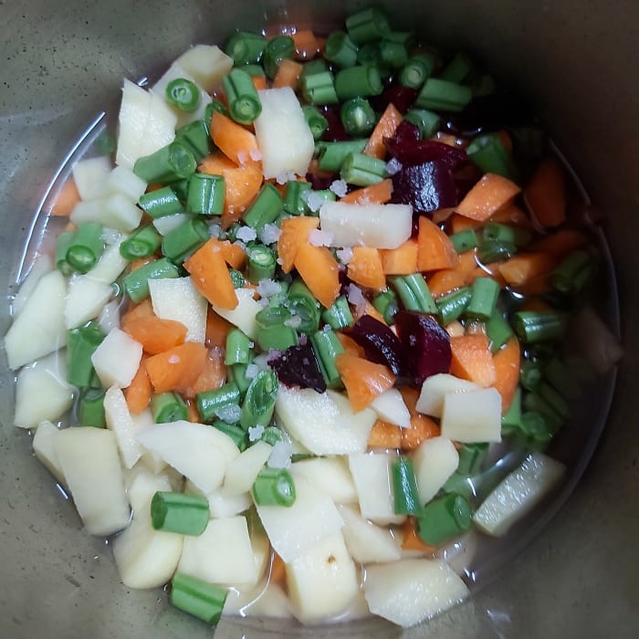 Add 1/2 cup of water and salt to taste (add just enough water to immerse the vegetables, not too much).