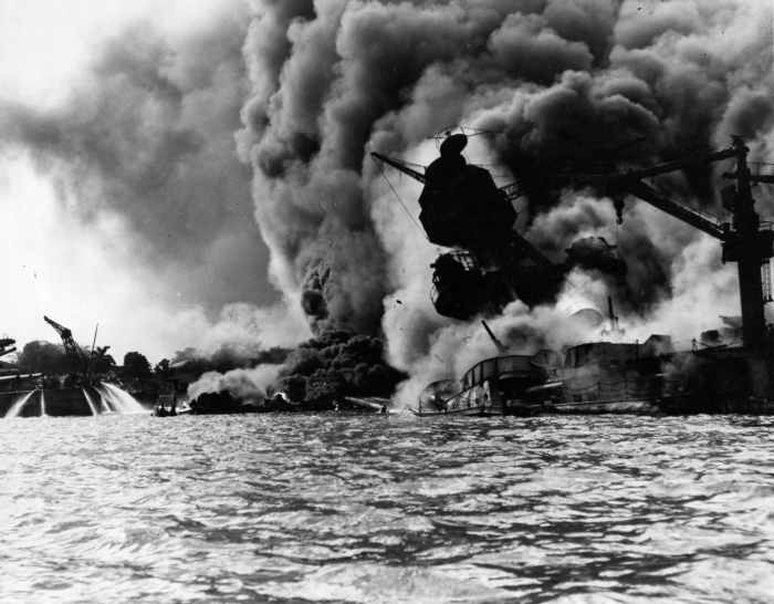 The USS Arizona sinking in Pearl Harbor after the Japanese attack.