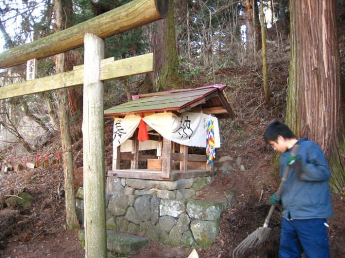 Tidying up at a Shinto shrine that's about a 5 minute walk from my house. My family a couple of generations back built it. Humble but cool!