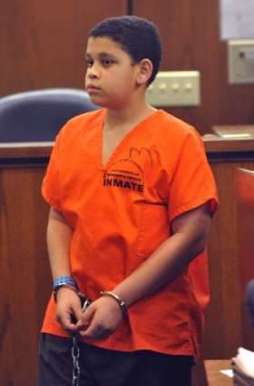 Now 13-year-old Christian at a pre-trial hearing earlier this year. He is being charged with first-degree-murder as an adult in the death of his younger brother.