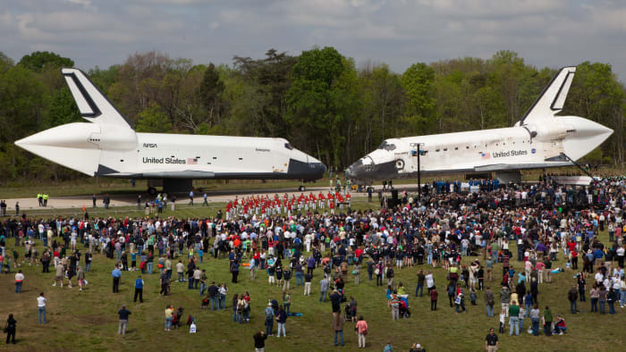 Enterprise (L) and Discovery (R) changing places at the Smithsonian's Udvar-Hazy Center.