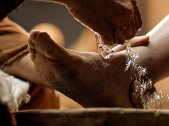 Foot washing was a common custom when guests visited. It was done by lowly servants. Here Jesus washes the disciples' feet.