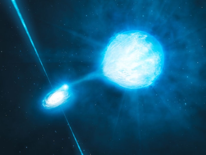 A black hole pulling gas from a nearby star to form an accretion disc. This system is known as an X-ray binary.