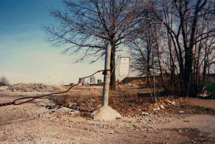 Looking east from 1301 N. Jefferson Avenue, April , 1996. The site is still vacant today, although more overgrown with brush and small trees.
