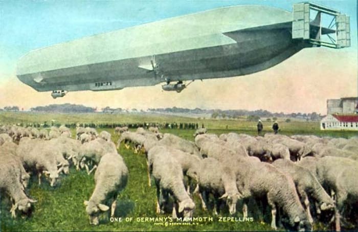 World War One: Pastoral scene showing one of Germany's mammoth zeppelins over grazing sheep.