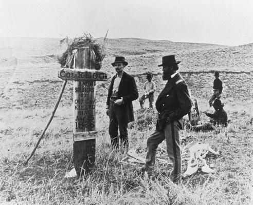 Soldiers standing by a marker showing where Keough's body was found. Original photo was taken by famed Western photographer Laton Alton Hoffman.