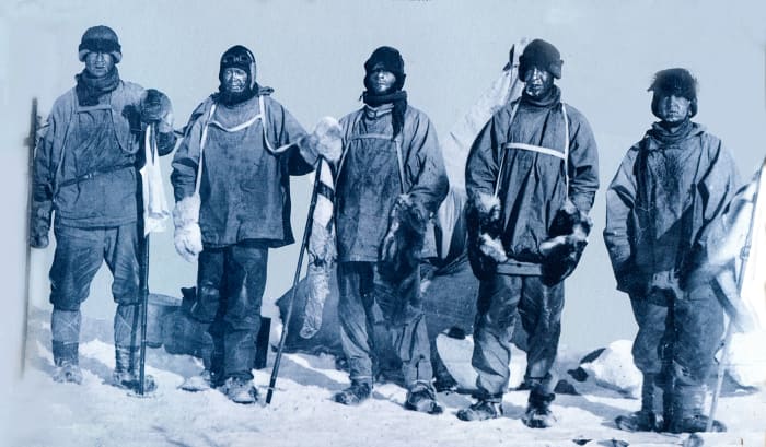 Scott and his team on the South Pole. Their faces reflect the grief of discovering they have lost.