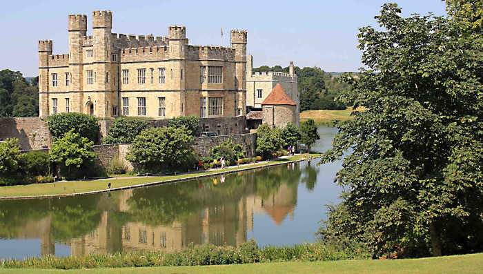Leeds Castle from the south, featuring the New Castle. Note the pathway between the lake and the outer wall - the route for the visitor to follow into the castle rooms.