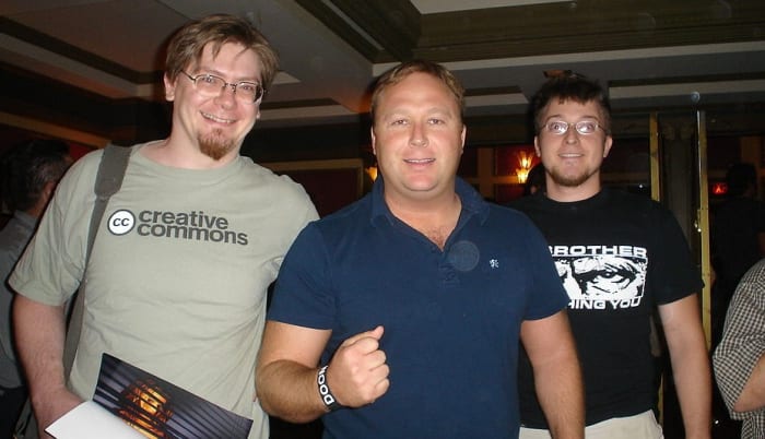The increasingly popular conspiracy theorist, Alex Jones (center), is increasingly being branded a fake or `double agent'.