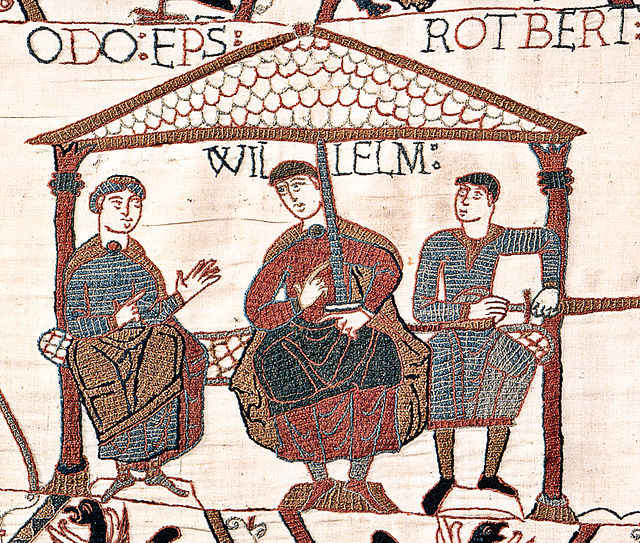 Image from the Bayeux Tapestry showing William the Conqueror (also sometimes referred to as William the Bastard) with his half-brothers. William is in the center, Odo is on the left with nothing in his hands, Robert is on the right holding a sword,