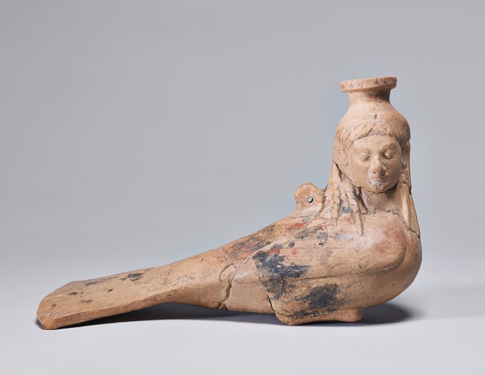 A perfume vase in the form of a Siren, circa 540 BC