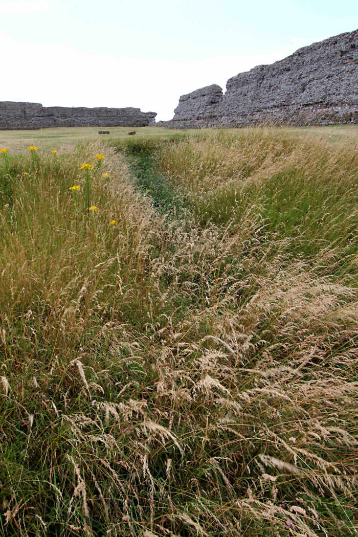 One of two 1st century Claudian ditches facing southwest, excavated as part of the initial defences of the landing site and aligned with the original coastline