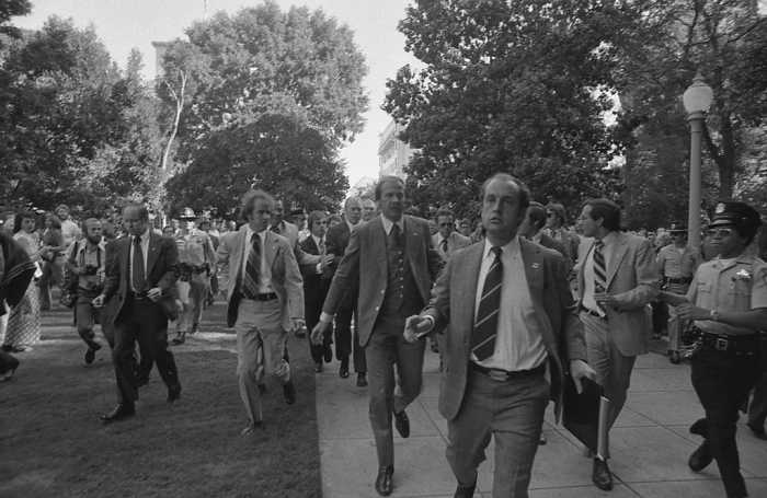 Following the September 5, 1975 attempt on U.S. President Ford's life by cultist Charles Manson Family member Lynette "Squeaky" Fromme, Secret Service agents rush President Ford towards the California State Capitol in Sacramento.