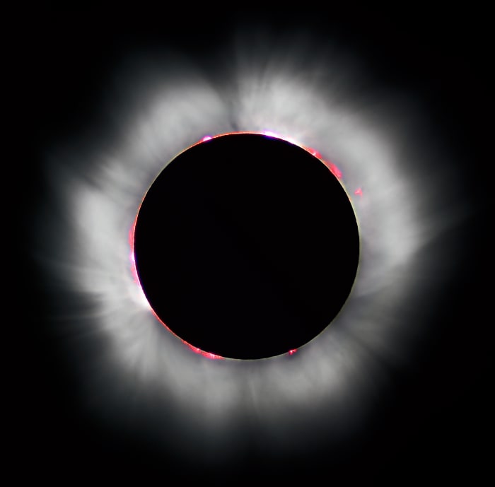 A total eclipse is surrounded by a corona of light, A corona is defined as the rarefied gaseous envelope of the sun.