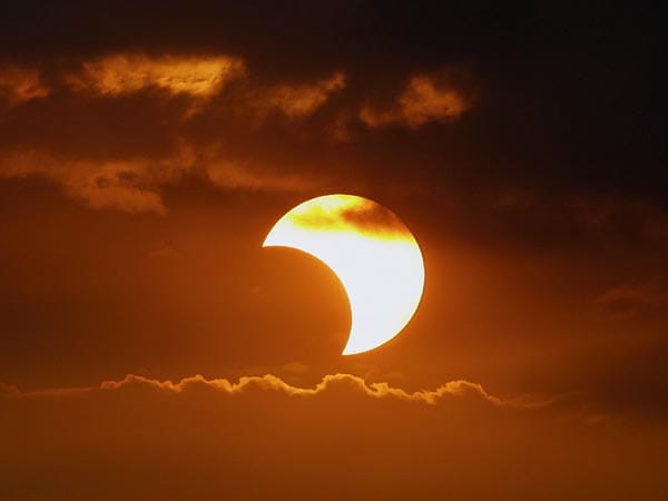 A partial solar eclipse or a total solar eclipse in progress often gives the impression that something is taking a big bite out of the sun.