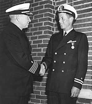 Lieutenant. John F. Kennedy, USNR, is awarded the Navy and Marine Corps medal for "...extremely heroic conduct as Commanding Officer of Motor Torpedo Boat 109...". He rescued a crew of PT 109 during WWII on 8-2-43, when hit by a Japanese destroyer.