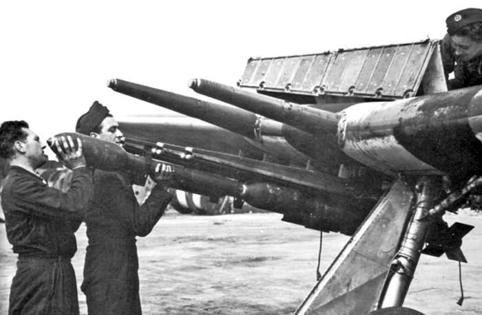 Ground crew load rockets into a Typhoon’s launch racks. The cannons can be seen protruding from the wing.