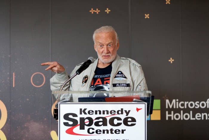 Buzz Aldrin speaks to members of the news media during a preview of the new Destination: Mars experience at the Kennedy Space Center Visitor Complex in 2016.