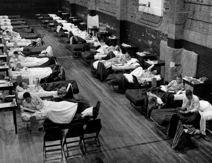 School infirmary in Georgia tech became overcrowded so students who have the flu were placed in a naval armory as seen in the photo...by: wahingtonpost