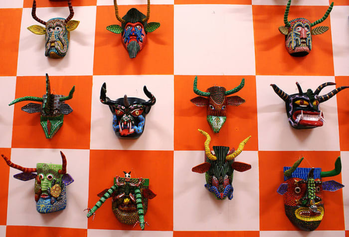 Artistic masks frighten away evil.