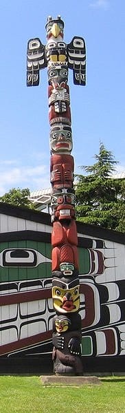Crest Pole in front of the Mungo Martin Kwakiutl big-house, raised in 1953 at the Royal British Columbia Museum in Thunderbird Park.