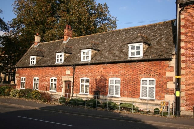 A 19 century almshouse, perhaps built with materials from an earlier almshouse on the same site. This would be similar to the one Trollope describes as Hiram's Hospital in The Warden.
