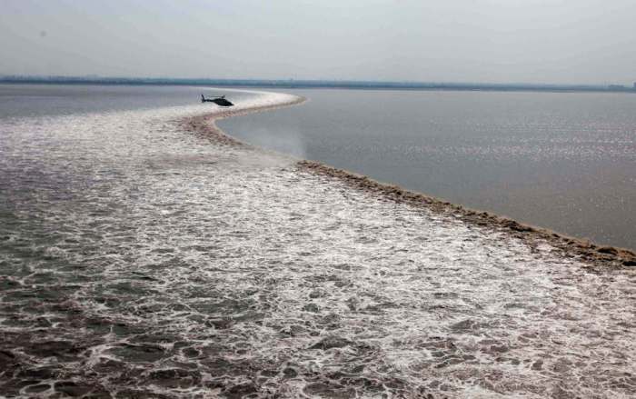 Between February and March the longest wave on Earth is generated twice as the Atlantic ocean roll up its waters and flood the amazon river in Brazil. Brazilians call this phenomenon Pororoca. The waves are 12 ft high and last about 30 minutes.