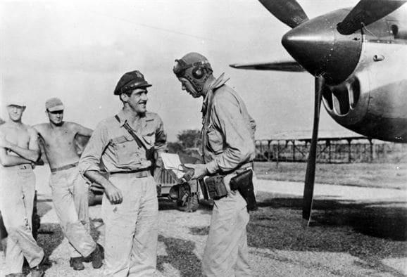 Lindbergh with Maj. Thomas B. McGuire (left). During the summer of 1944, Lindbergh visited the Southwest Pacific Theatre and devised economical flight techniques to extend the range of P-38 fighters.