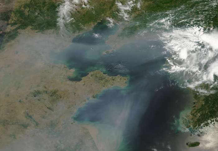 The vast clouds of pollution from China spiral off its coast into Korea : during the pre-capitalist era, China was too poor to produce such a huge amount of noxious fumes.