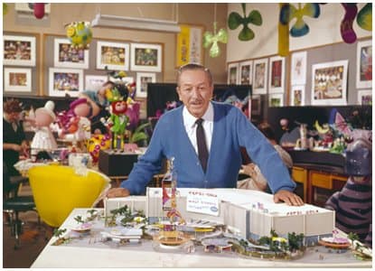 Walt Disney with a model of the "It's A Small World" ride. His company would design three other attractions at the fair, and inspire other pavilions to include Disneyesque attractions.