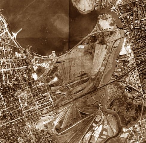 The Flushing River valley. The river is to the right, the vast Corona Ash Dumps to the left. This early aerial photo was taken around 1915, prior to the building of Roosevelt Ave