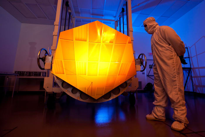 NASA's James Webb Space Telescope has a mirror that is coated with gold (element 79) covered with a thin layer of protective glass. The gold reflects red and infrared light.