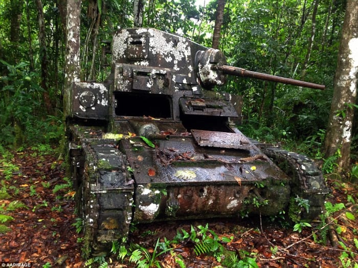 Japanese tank not very effective in the jungle of Guadalcanal rusting in place were it was knocked out of action.