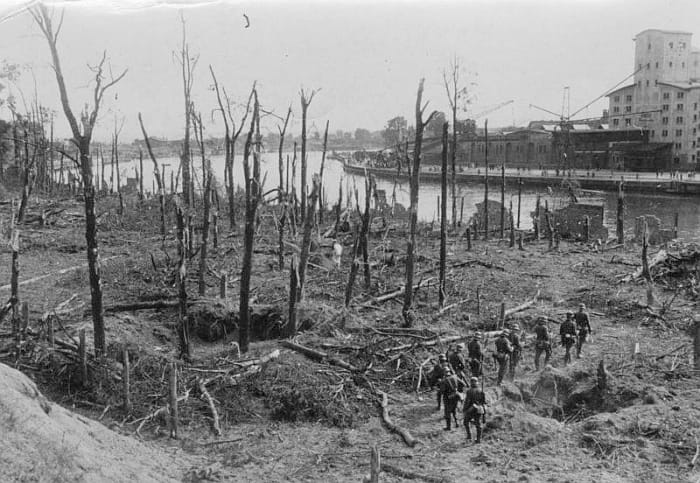 German troops in the ruined forest of Westerplatte the day after it fell. In the distance (southwest) is the channel where the battleship Schleswig-Holstein bombarded Westerplatte. September 8, 1939.